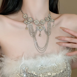 Close-up of elegant silver tiered rhinestone fringe necklace with teardrop crystal pendants