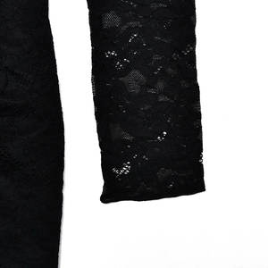 Close-up of intricate black lace texture and floral embroidery on bodysuit sleeves