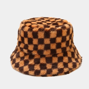 Detail view of the thick checkered faux fur texture on this winter bucket hat