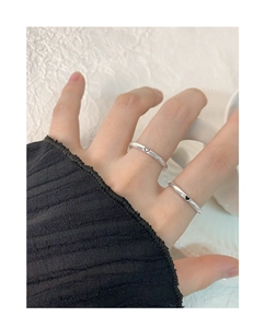 Minimalist S925 sterling silver rings with solid and hollow black heart patterns on fingers