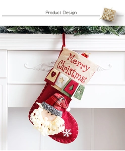 Detail of red Christmas stocking with 3D Santa Claus and Merry Christmas text
