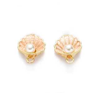 Detailed close-up of golden shell pendants with white pearls for DIY jewelry making