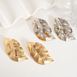 Chic metallic leaf earrings in gold and silver finish with textured organic details