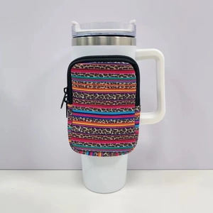 Detail of colorful striped leopard pouch attached to a 40oz insulated tumbler handle
