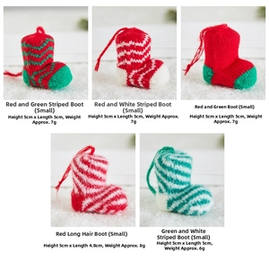 Detailed view of handmade knitted Christmas mini boot ornaments in festive stripe patterns