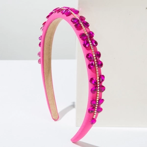 Detail of pink baroque headband with rose red rhinestones and fine white crystals