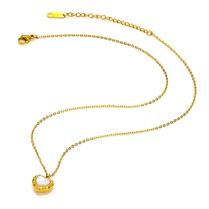 Detailed close-up of heart pendant with shell inlay and gold-plated stainless steel chain