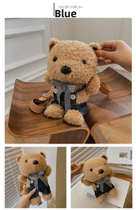 Close-up of cute plush bear crossbody bag with blue denim overalls and adjustable strap