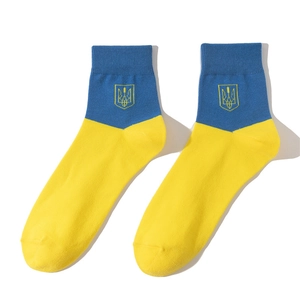 Detail of Ukraine flag socks featuring blue and yellow cotton with Trident emblem