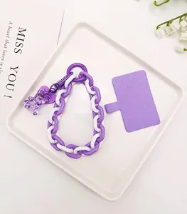 Detailed view of purple bear phone charm strap with chunky chain link and connector pad