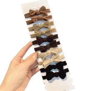 Set of 10 elastic bow hair ties in neutral earth tones including brown and beige