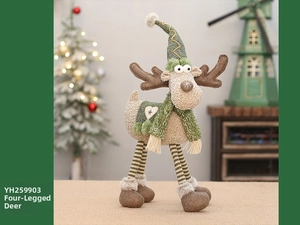 Close-up of a plush Christmas reindeer ornament with a green knitted hat and scarf