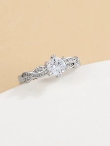 Close-up of classic silver crown ring featuring a twisted band with pavé zircon accents
