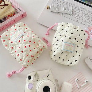 Quilted drawstring camera pouch with heart pattern, soft protective storage for compact cameras