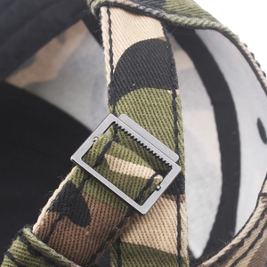 Close-up of jungle camouflage cotton baseball cap with adjustable metal slider buckle