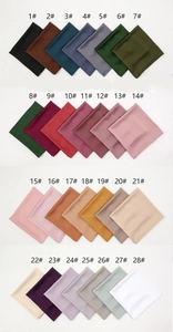 Detail showing 28 assorted colors of soft matte silk satin square scarves with index numbers