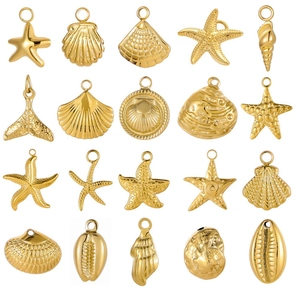 Golden stainless steel ocean theme charms including starfish, seashells and mermaid tails