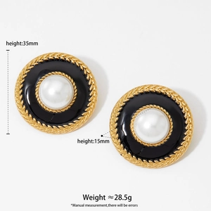 Vintage round gold earrings with white pearl center and black enamel rope border
