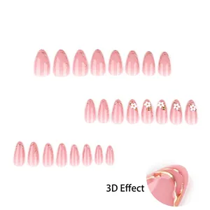 Faux ongles amande avec gaufrage doré 3D fleurs blanches et dégradé rose doux