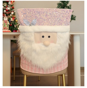 Pink sequin Santa chair cover with plaid detail shown on a dining chair in a festive setting
