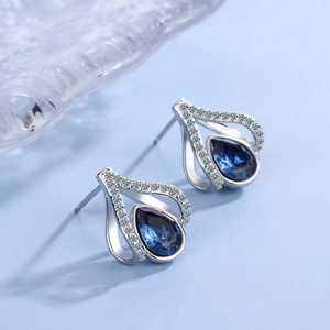 Silver teardrop earrings with deep blue crystals and micro-pave cubic zirconia accents