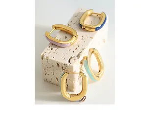 Detail view of colorful enamel U-shaped earrings in light purple, blue and mint green