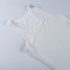 Close-up of white ribbed knit fabric texture on a sleeveless sporty bodysuit top
