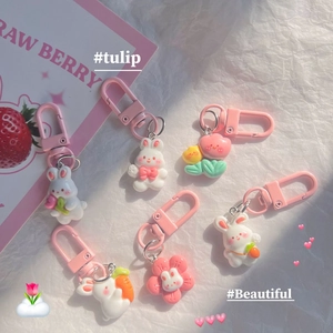 Set of cute pink resin rabbit and tulip keychains with colorful charms for bags