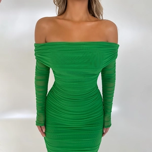 Detail of green off-shoulder ruched dress showing high-quality mesh fabric texture