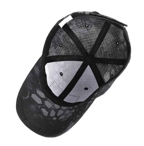 Detailed top view of a tactical camouflage baseball cap showing honeycomb pattern and inner stitching
