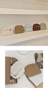 Detail view of mini semicircular coin purses in five colors with lychee pattern leather