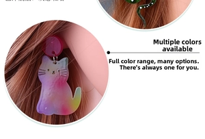 Detail view of multi-colored acrylic cat and snake drop earrings on long-haired model