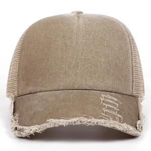 Close-up of vintage washed denim baseball cap with distressed brim and mesh back