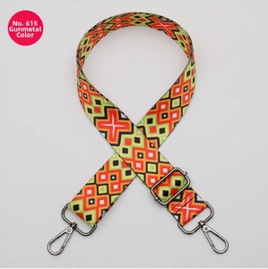 Detail of adjustable geometric strap with gunmetal hardware and colorful diamond patterns