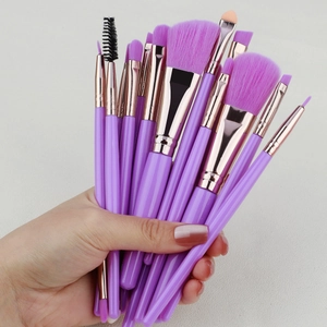 Macro view of purple makeup brush bristles with elegant rose gold metal ferrules