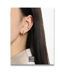 Close-up of S925 sterling silver geometric hoop earrings with 18mm diameter on model