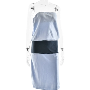 Detail view of a slim-fit satin tube dress featuring a blue and black color-block design