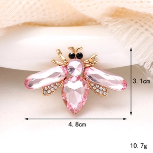 Pink rhinestone bee brooch in gold alloy setting with 4.8cm x 3.1cm dimensions
