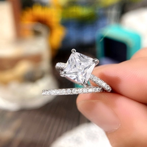 Detailed shot of princess cut square diamond ring set with high clarity stones