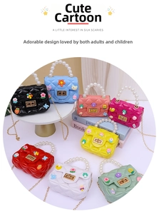 Collection of mini jelly bags with pearl handles and colorful cartoon charms in eight colors