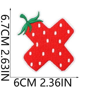 Close-up of strawberry alphabet patch with precise embroidery and size measurements