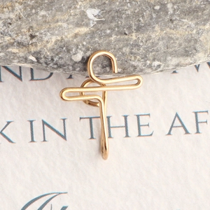 Minimalist gold-plated stainless steel fake nose ring with a geometric cross design