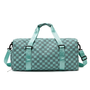 Large travel duffel bag with blue and grey checkered pattern and adjustable strap