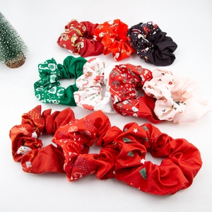 9-piece set of Christmas scrunchies with festive patterns on a clean white background