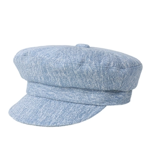 Chic light blue denim newsboy cap with classic top button and structured retro design