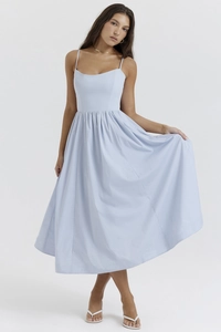 Detail of light blue backless sundress featuring slim straps and a cinched waistline