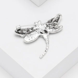 Vintage silver dragonfly brooch with natural abalone shell inlays seen from the back view