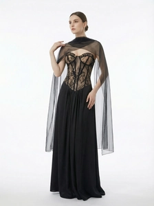 Elegant black lace corset evening gown with long sheer cape and flowing skirt