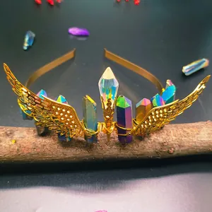 Macro shot of handmade gold crystal headband with iridescent pillars on a wood branch