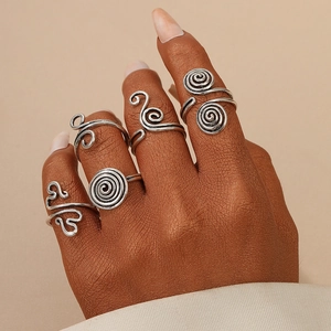Vintage silver bohemian ring set with textured spiral and geometric patterns